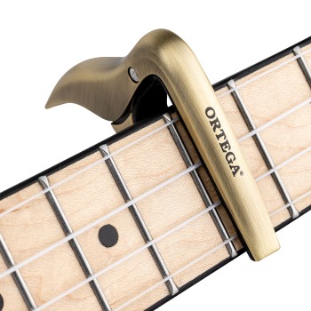 Каподастер за банджо и мандолини Ortega BGCAPO BRUSHED BRASS